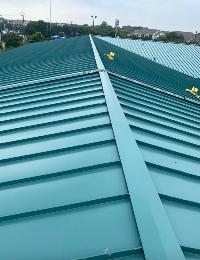 Green commercial metal roof ridge and valley for Metal Roof Repair in Antwerp